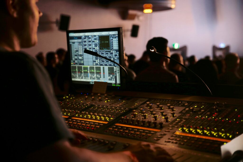 Sound engineer operating a mixing console during a live event